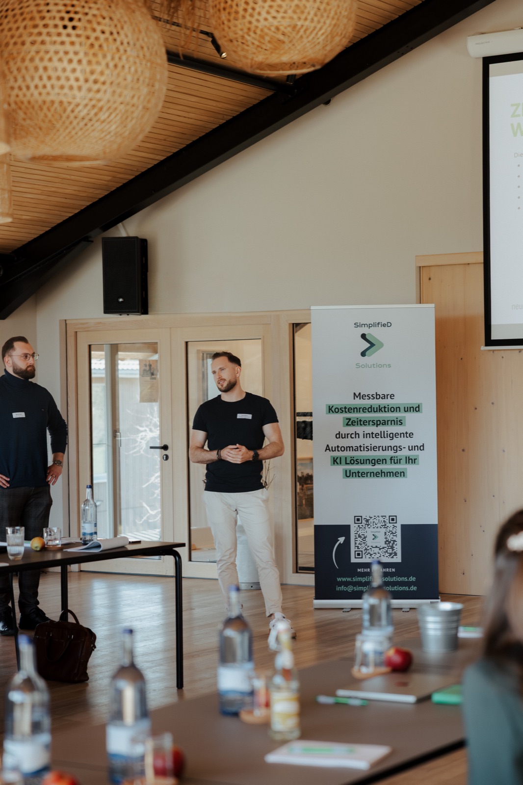 Gabriel Michelberger presenting in front of the SimplifieD banner
